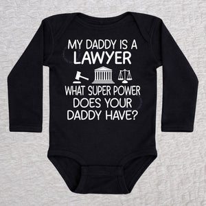 My Daddy Is a Lawyer long sleeve baby bodysuit in black featuring a gavel, courthouse, and scales of justice design
