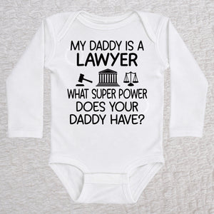 My Daddy Is a Lawyer long sleeve baby bodysuit in white featuring a gavel, courthouse, and scales of justice design