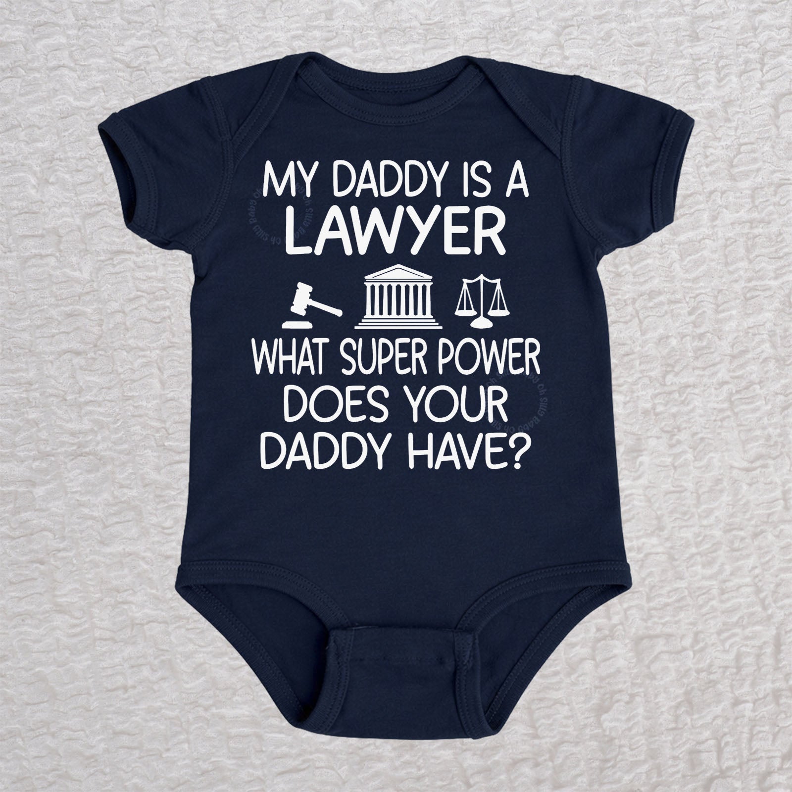 My Daddy Is a Lawyer short sleeve baby bodysuit in navy featuring a gavel, courthouse, and scales of justice design