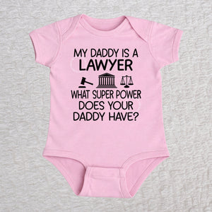 My Daddy Is a Lawyer short sleeve baby bodysuit in pink featuring a gavel, courthouse, and scales of justice design