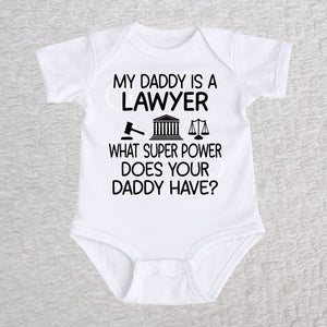 My Daddy Is a Lawyer short sleeve baby bodysuit in white featuring a gavel, courthouse, and scales of justice design