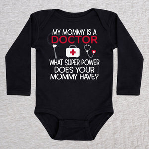My Mommy Is a Doctor long sleeve baby bodysuit in black featuring a reflex hammer, doctor's bag, and stethoscope design