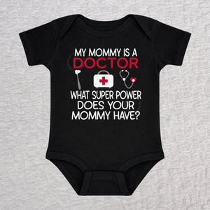 My Mommy Is a Doctor short sleeve baby bodysuit in black featuring a reflex hammer, doctor's bag, and stethoscope design