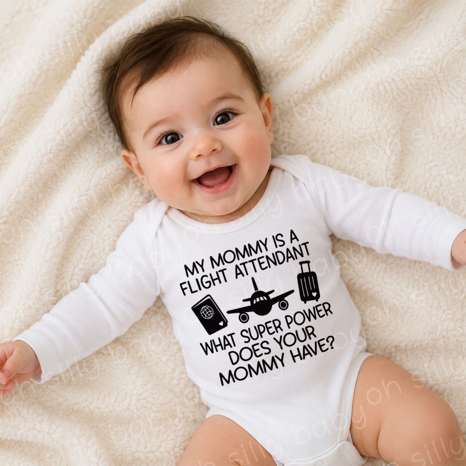 Smiling baby wearing a My Mommy Is a Flight Attendant long sleeve baby bodysuit featuring a passport, airplane, and suitcase design