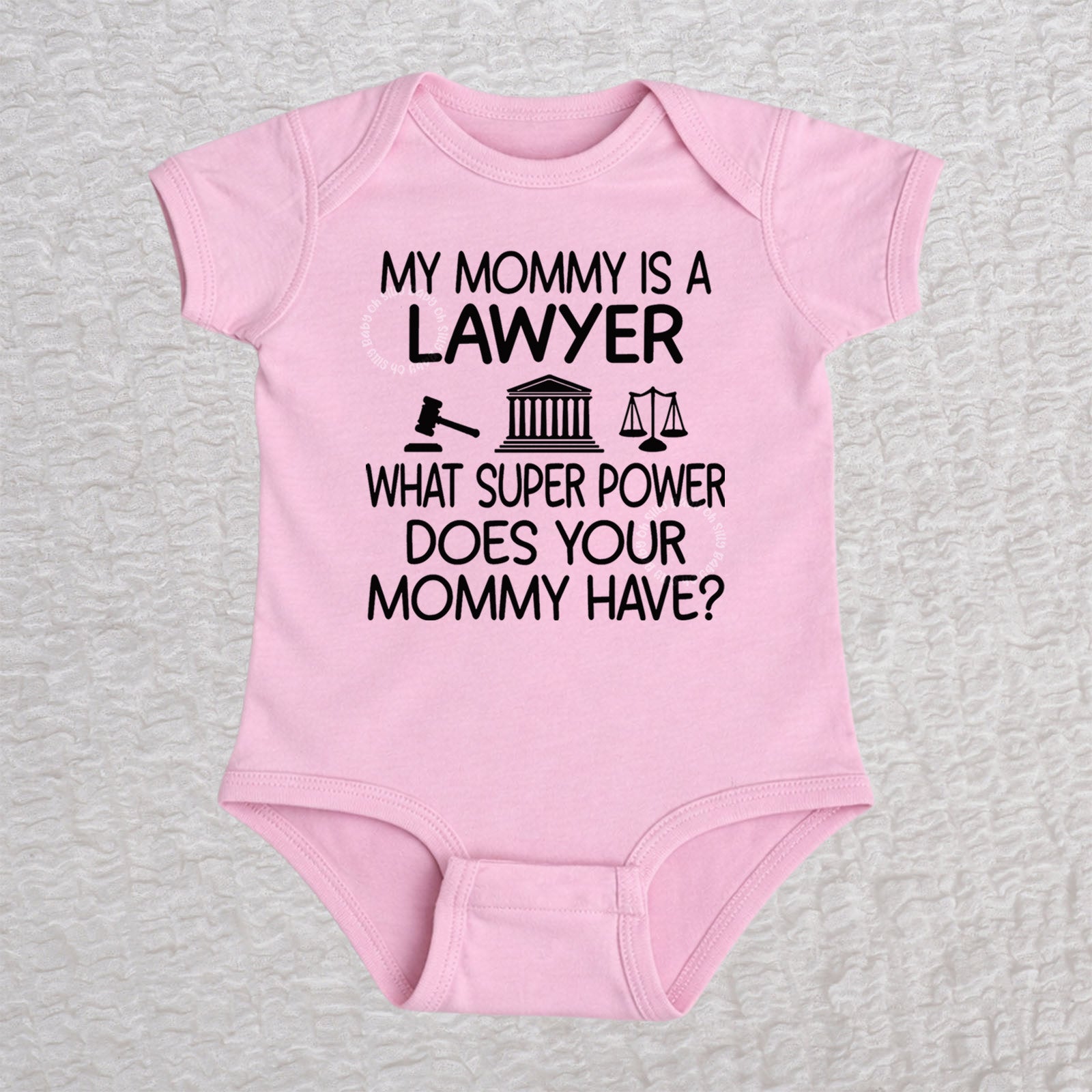 My Mommy Is a Lawyer short sleeve baby bodysuit in pink featuring a gavel, courthouse, and scales of justice design