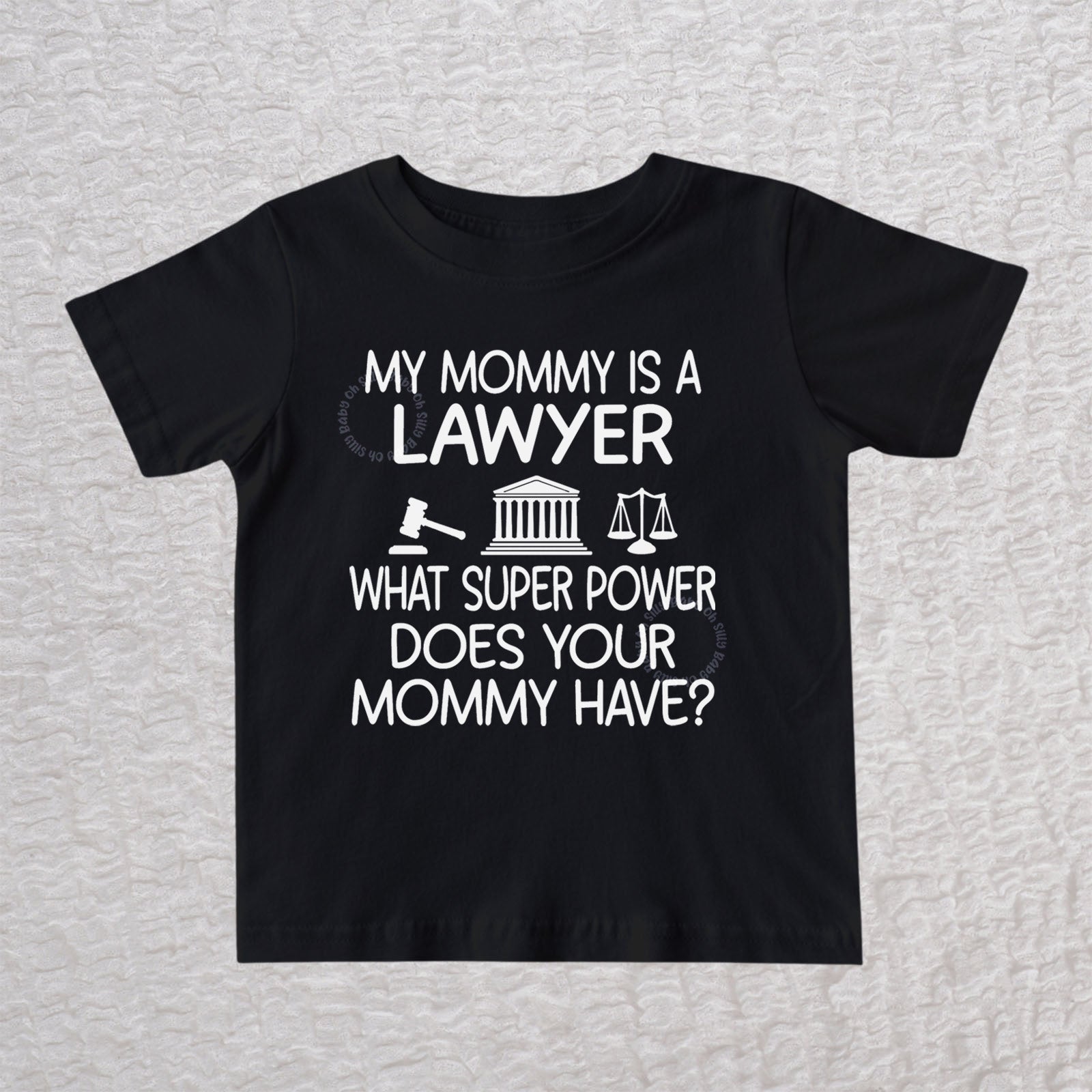 My Mommy Is a Lawyer unisex baby and toddler t-shirt in black featuring a gavel, courthouse, and scales of justice design
