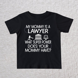 My Mommy Is a Lawyer unisex baby and toddler t-shirt in black featuring a gavel, courthouse, and scales of justice design