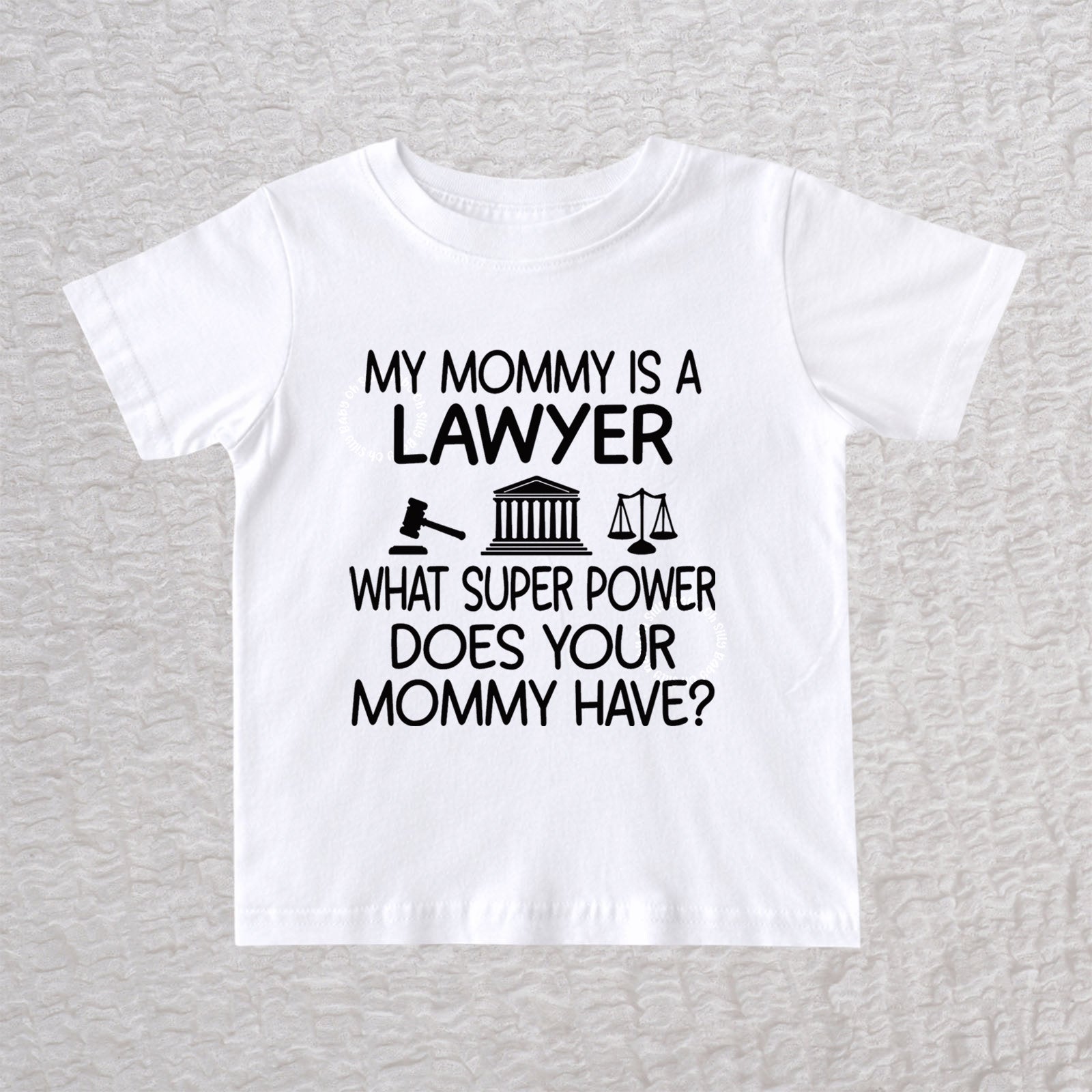 My Mommy Is a Lawyer unisex baby and toddler t-shirt in white featuring a gavel, courthouse, and scales of justice design