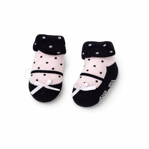 Pair of black and pink baby socks with polka dots 
