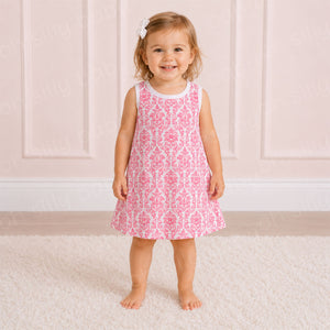 Toddler girl wearing a pink damask print girls dress in size 2/3T