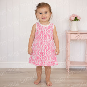 Toddler girl wearing a pink damask print girls dress in size 2/3T