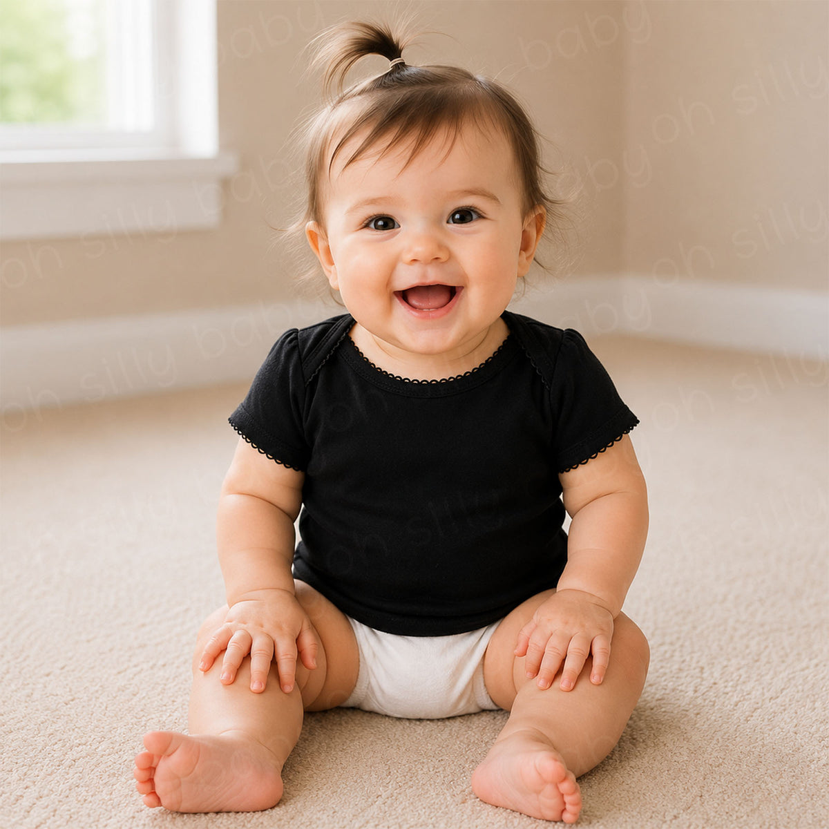 Baby girl wearing a plain black short sleeve baby and toddler t-shirt