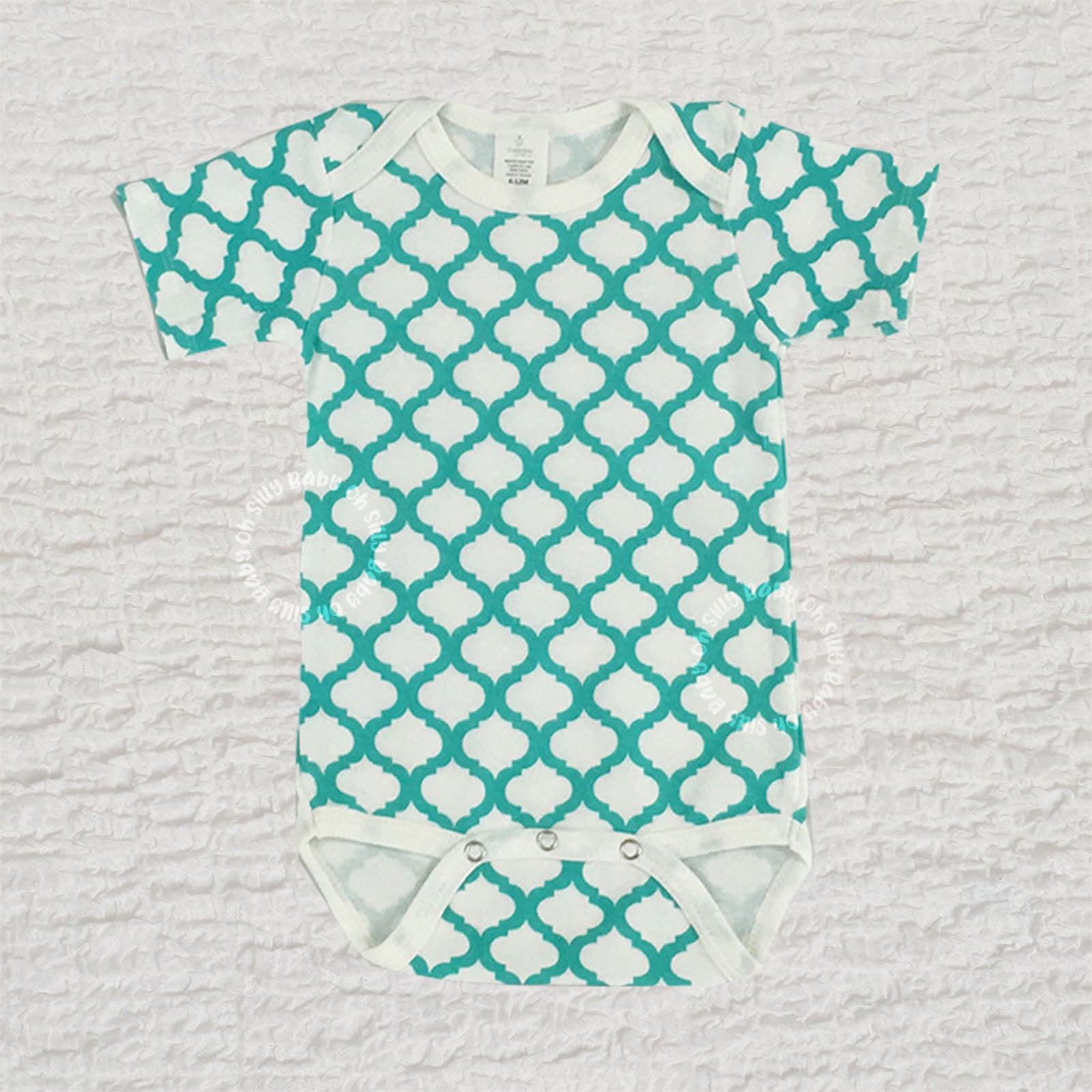 Turquoise and white Quatrefoil Print baby bodysuit made from 100% cotton interlock knit fabric