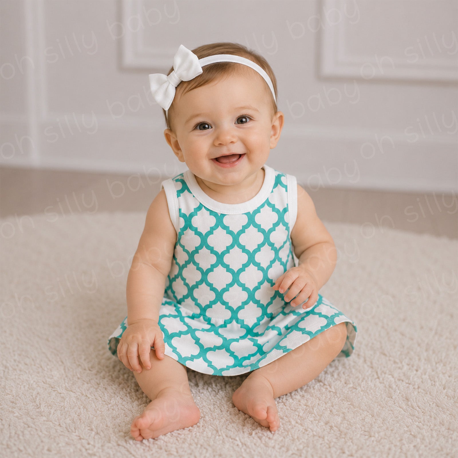 Baby girl wearing a Quatrefoil Print Grow With Me Dress made from 100% cotton